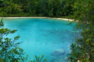 Crystal clear blue lake in the highlands of West Papua